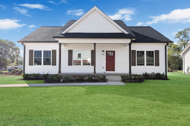 view of front of house featuring a front yard and a porch