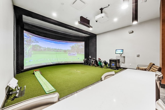 game room with golf simulator