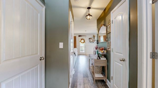 hall with hardwood / wood-style floors