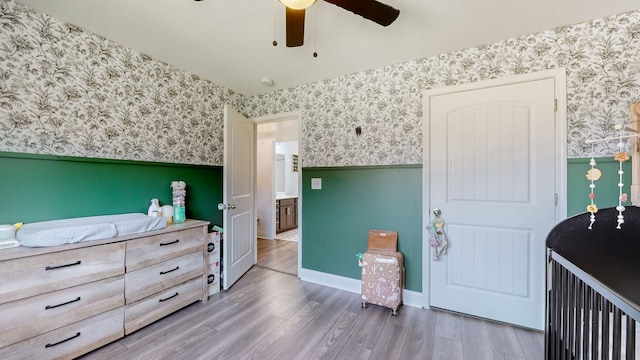 bedroom with ceiling fan and hardwood / wood-style flooring