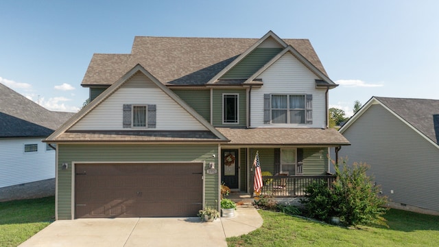 craftsman inspired home featuring a front yard, a garage, and a porch