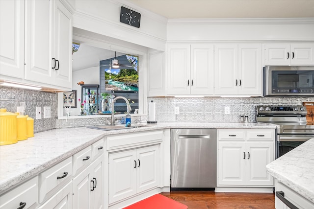 kitchen featuring white cabinetry, sink, and stainless steel appliances