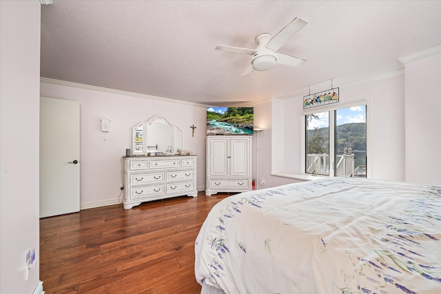 bedroom featuring ceiling fan, access to exterior, ornamental molding, and dark wood-type flooring