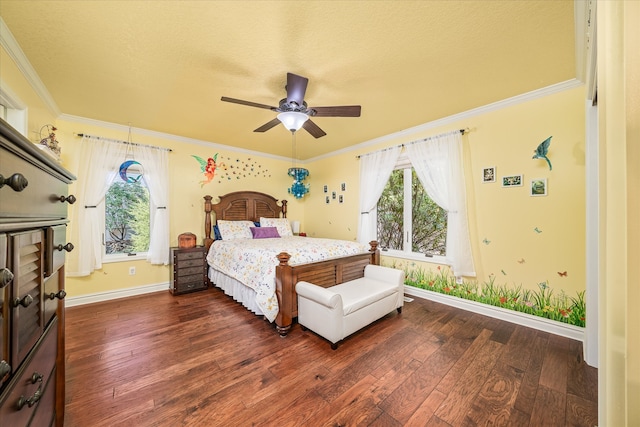 bedroom featuring ceiling fan, a textured ceiling, dark hardwood / wood-style floors, and crown molding