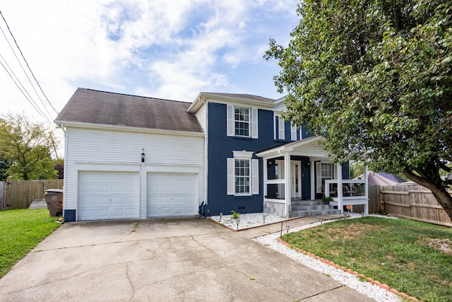 view of front facade with a garage and a front yard