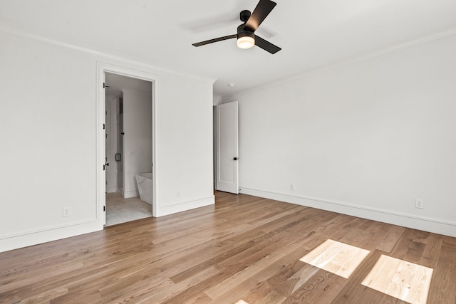 empty room with ceiling fan and light hardwood / wood-style floors