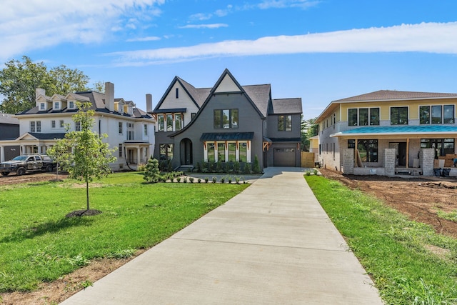 view of front of home featuring a front yard and a garage