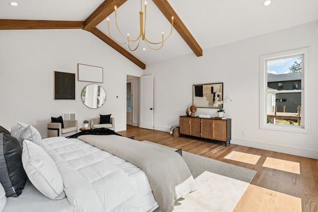 bedroom featuring lofted ceiling with beams, a notable chandelier, and hardwood / wood-style floors