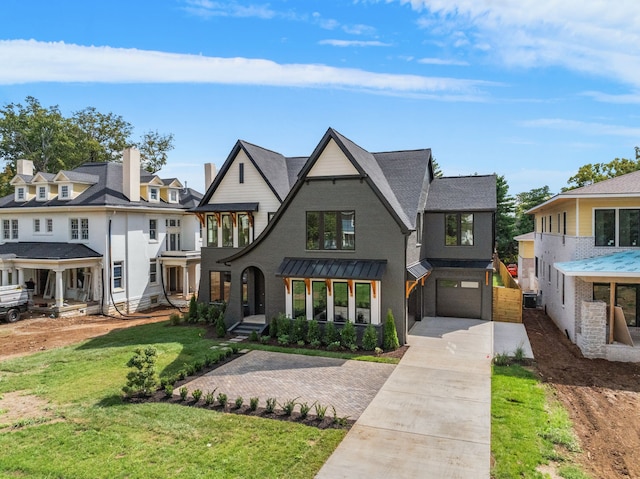 view of front of home featuring a garage and a front lawn