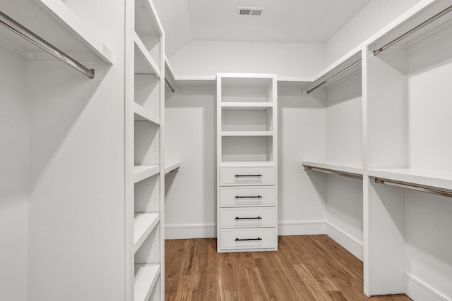 spacious closet with light hardwood / wood-style floors