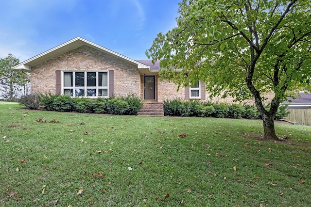 ranch-style house featuring a front lawn