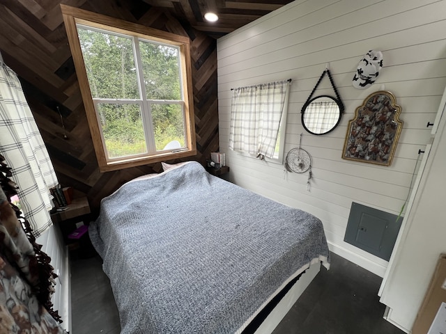 bedroom with wooden walls