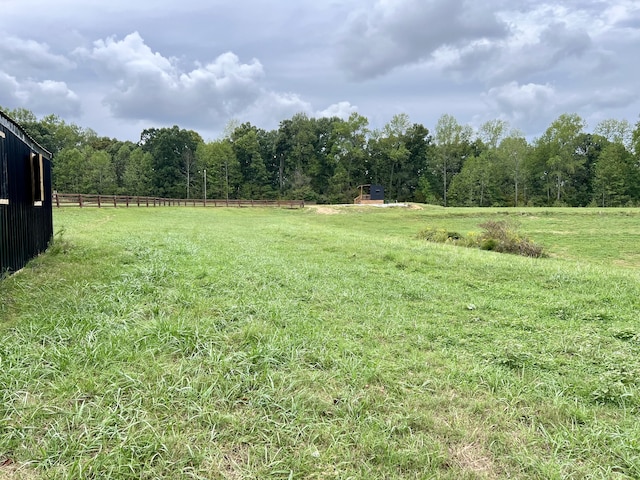 view of yard with a rural view