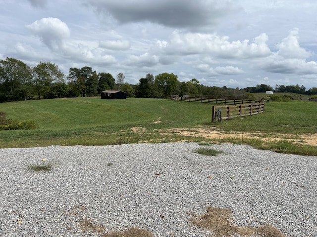 view of yard with a rural view