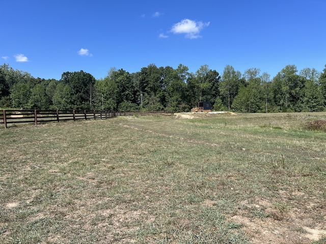 view of yard with a rural view