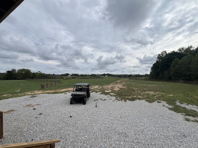 view of yard with a rural view