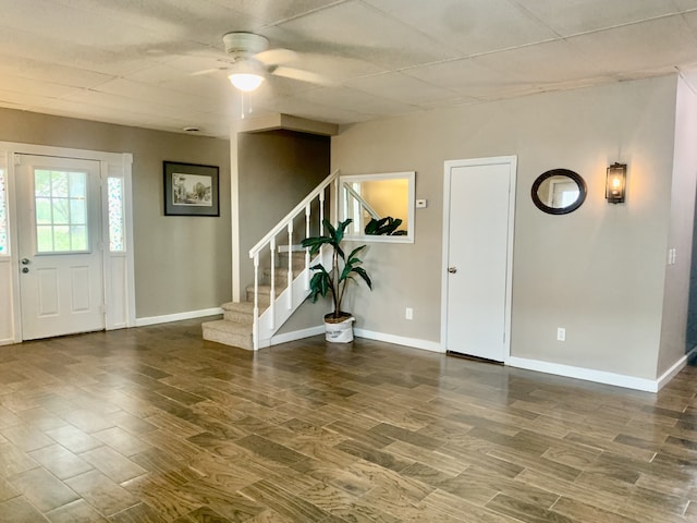 foyer featuring ceiling fan and dark wood-type flooring