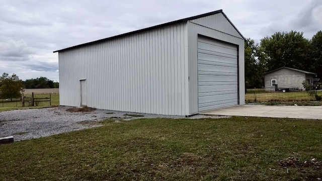 garage featuring a yard