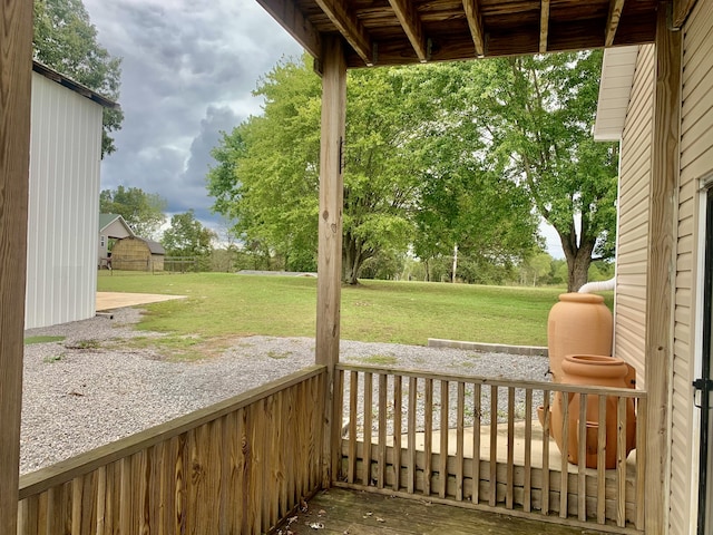 wooden deck with a yard