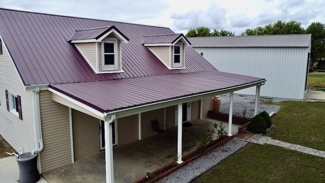 back of house with a lawn