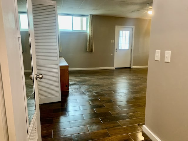 spare room featuring ceiling fan and dark hardwood / wood-style flooring