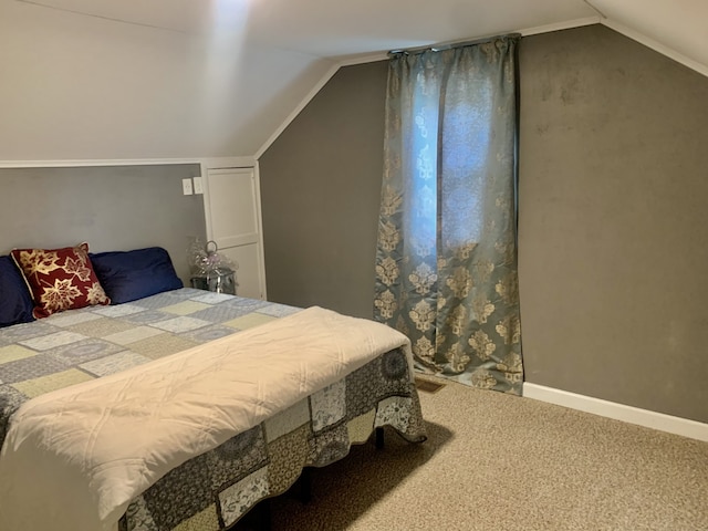 carpeted bedroom featuring vaulted ceiling