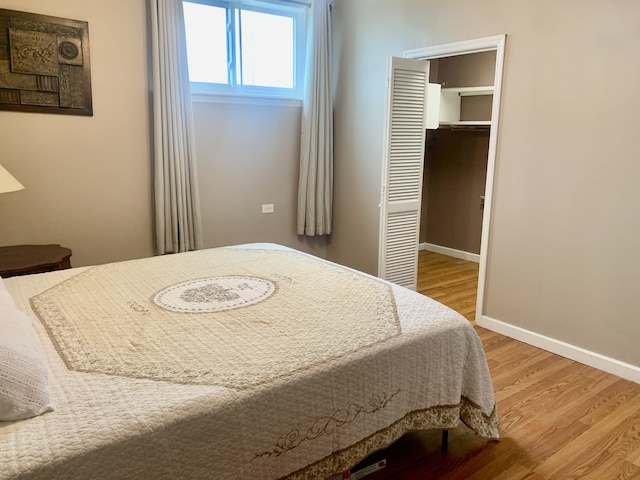 bedroom with hardwood / wood-style floors