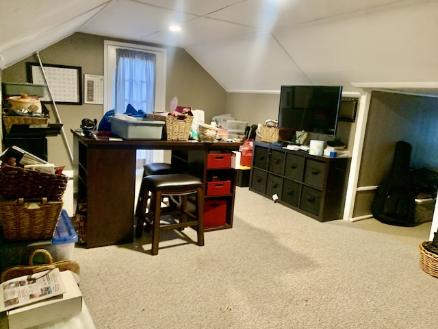 office with lofted ceiling and carpet