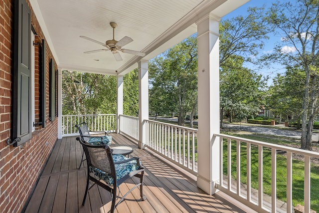 deck with ceiling fan and covered porch