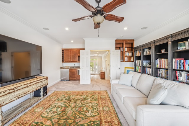 living room featuring ornamental molding and ceiling fan