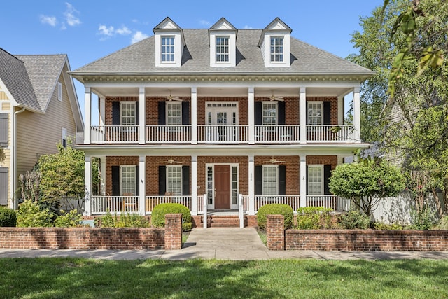 view of front of home featuring a balcony and covered porch