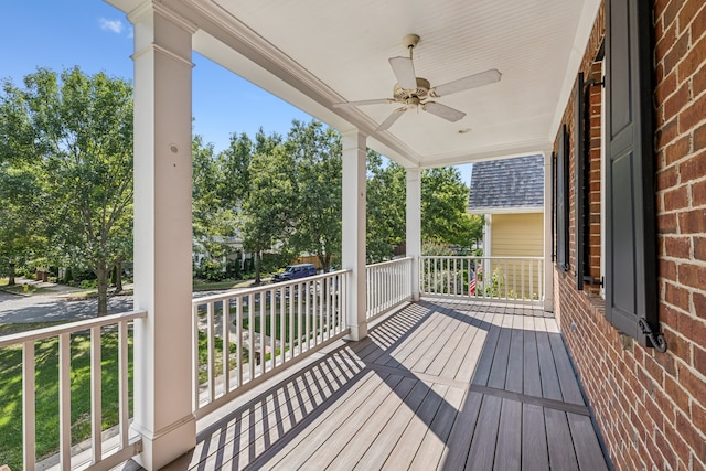 wooden terrace featuring ceiling fan and covered porch