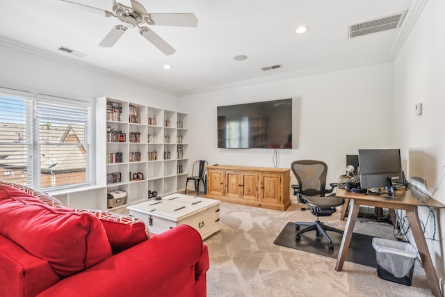 carpeted office space with ceiling fan and crown molding