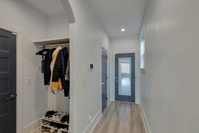 doorway to outside with light wood-type flooring