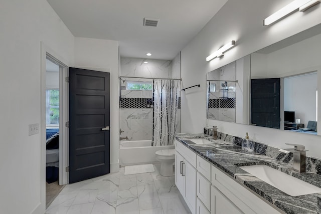 full bathroom with vanity, shower / tub combo, and toilet