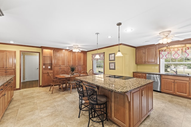 kitchen with stainless steel dishwasher, a center island, ceiling fan, and a wealth of natural light