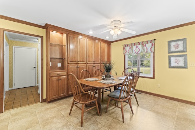 dining area featuring ornamental molding, ceiling fan, and light tile patterned flooring