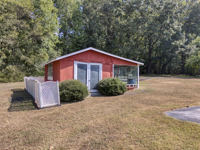 view of outdoor structure with a lawn