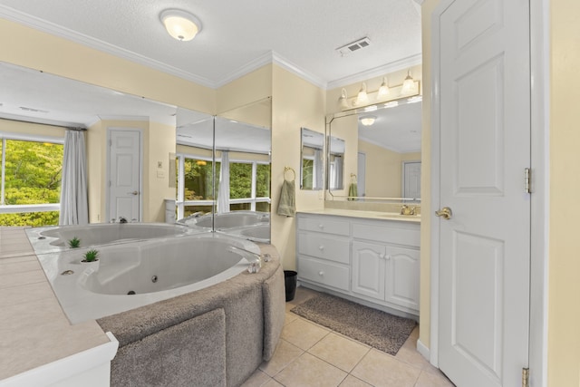 bathroom with a bathtub, ornamental molding, tile patterned flooring, and vanity