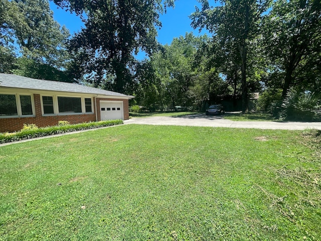 view of yard with a garage