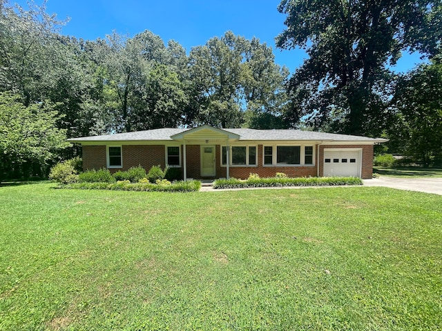 single story home featuring a front yard and a garage