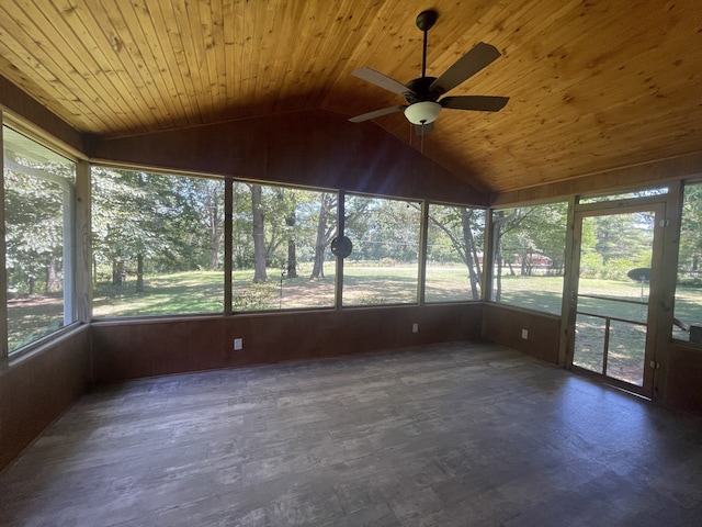 unfurnished sunroom featuring ceiling fan, lofted ceiling, plenty of natural light, and wooden ceiling