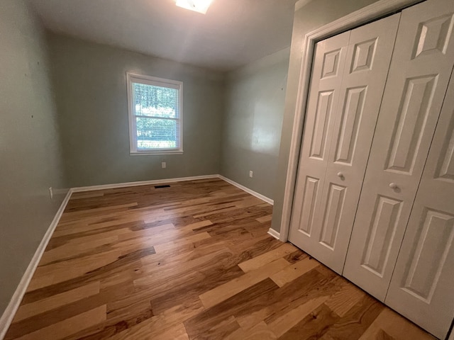 spare room featuring light hardwood / wood-style flooring