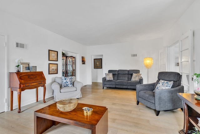 living room with light hardwood / wood-style floors