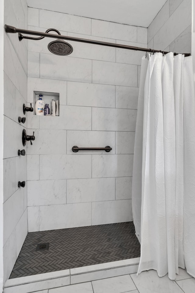 bathroom with a shower with shower curtain