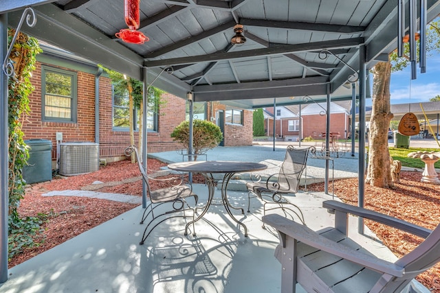 view of patio featuring ceiling fan, a gazebo, and central air condition unit