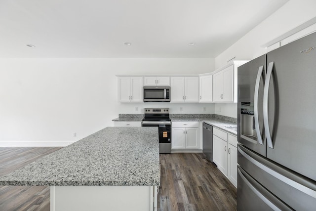 320 Moffat St Unit 102, Monteagle, TN 37356 - kitchen with stainless steel appliances, dark wood-style flooring, white cabinetry, a center island, and recessed lighting