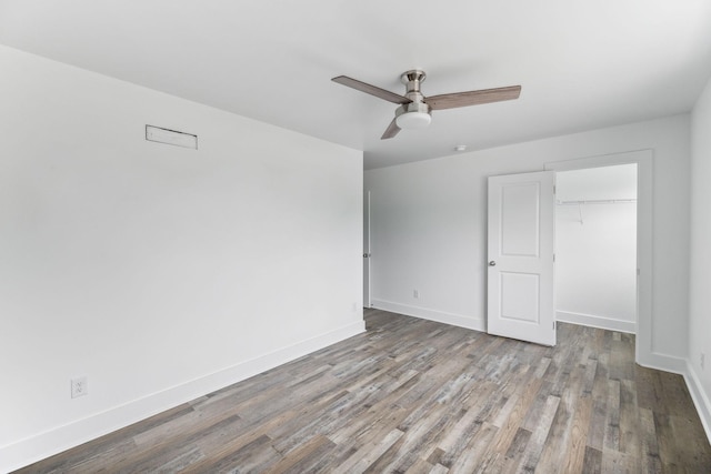 320 Moffat St Unit 102, Monteagle, TN 37356 - unfurnished bedroom featuring wood finished floors, a closet, baseboards, and a ceiling fan