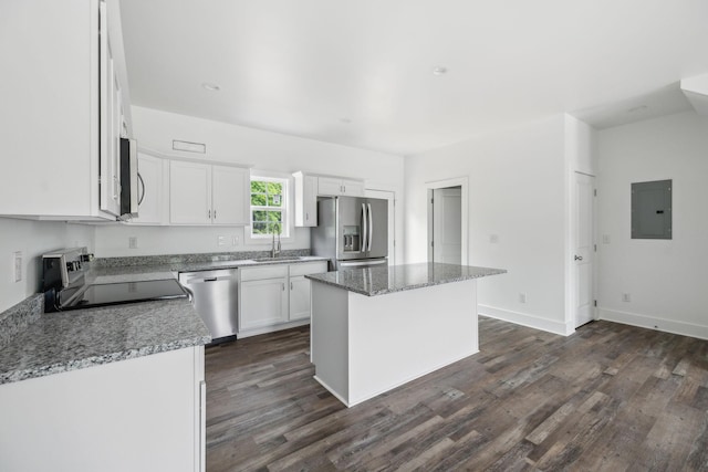 320 Moffat St Unit 102, Monteagle, TN 37356 - kitchen with stainless steel appliances, electric panel, dark wood-style flooring, a kitchen island, and white cabinetry