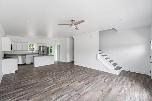 320 Moffat St Unit 103, Monteagle, TN 37356 - unfurnished living room featuring dark wood-style floors, ceiling fan, stairway, baseboards, and recessed lighting